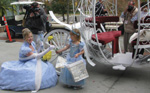 Cinderella presents
                                        a rose to Brianna Causey